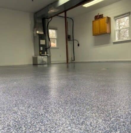 touch of blue epoxy flake flooring for homeowner garage