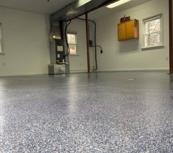 touch of blue epoxy flake flooring for homeowner garage