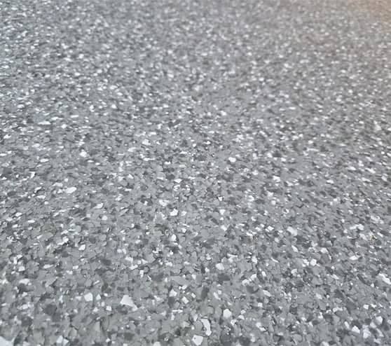 close-up of epoxy flake flooring for homeowner garage
