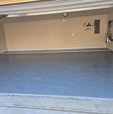 homeowner garage with new epoxy flake flooring installed