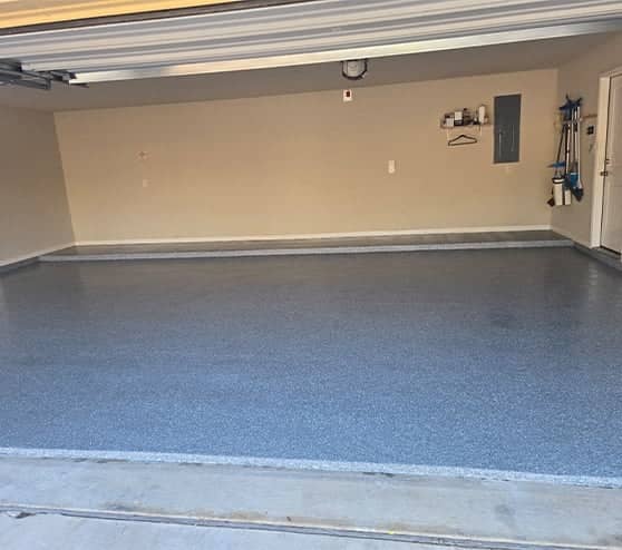 homeowner garage with new epoxy flake flooring installed