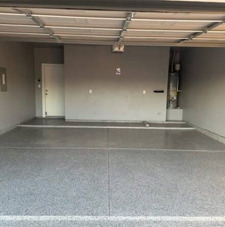 homeowner garage with new grey epoxy flake flooring