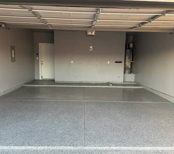 homeowner garage with new grey epoxy flake flooring