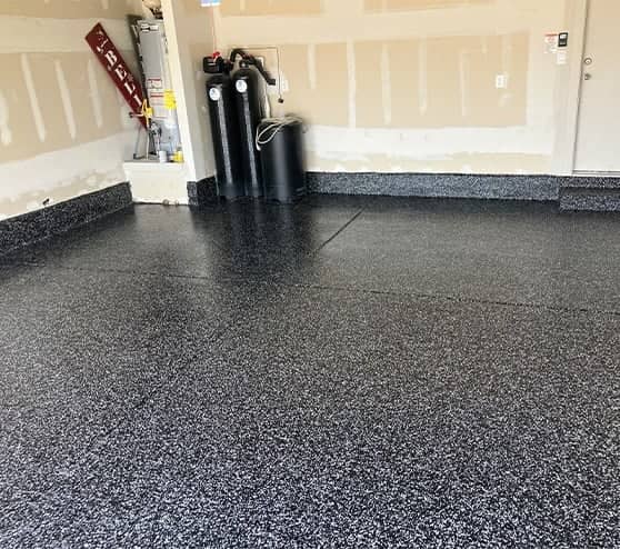 homeowner garage with new installation of epoxy flake flooring