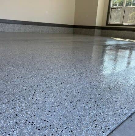 close-up of cabin fever epoxy flake flooring for homeowner