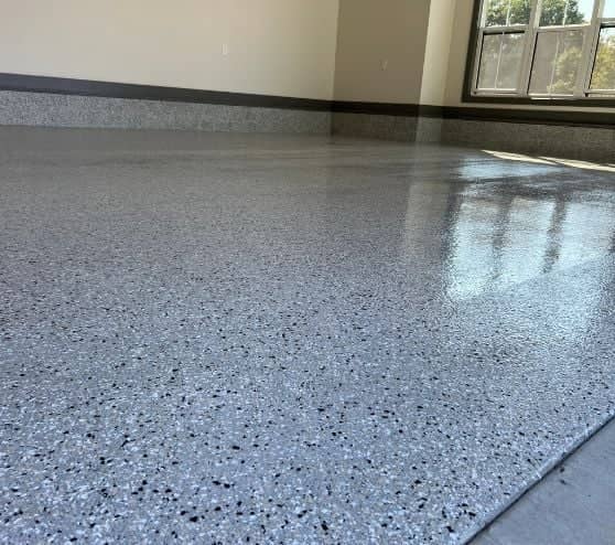 close-up of cabin fever epoxy flake flooring for homeowner