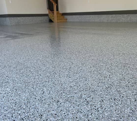 close-up of cabin fever epoxy flake flooring freshly installed for homeowner garage
