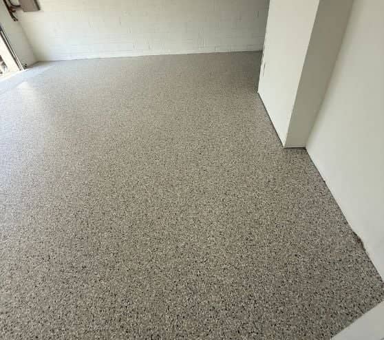 homeowner garage with new epoxy flake flooring installed
