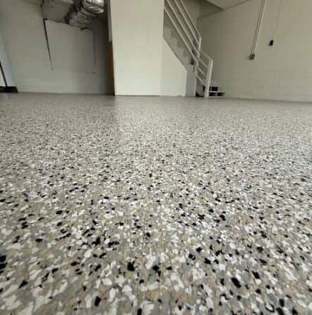 close-up of cabin fever epoxy flake flooring installed for homeowner garage