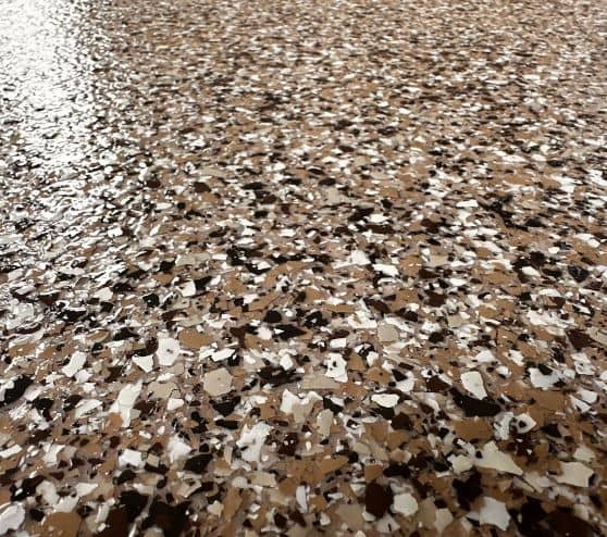 close-up of cappuccino epoxy flake flooring for homeowner patio