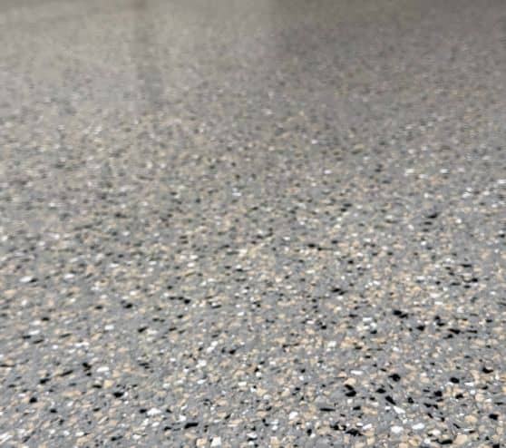 close-up of Dolphin Flake Epoxy Flake Flooring for homeowner garage