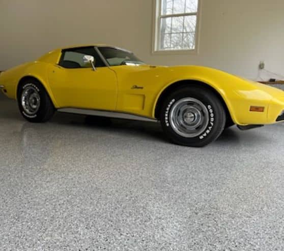 corvette parked on new epoxy flooring in garage