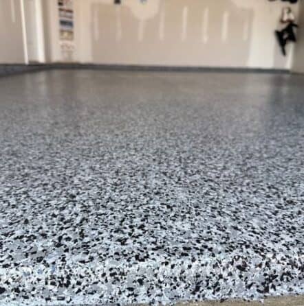 front view close-up of graphite epoxy flake flooring installed for homeowner garage