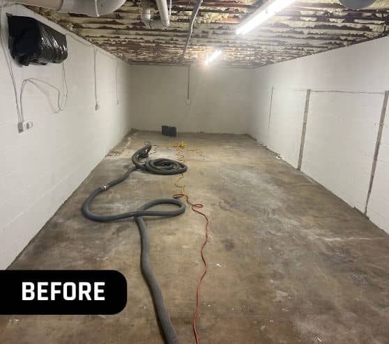 front view of homeowner basement with old concrete flooring before portrait
