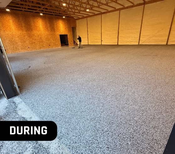 during portrait of mach one® installing new graphite epoxy flake flooring