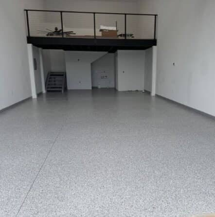 homeowner garage with new Feathered Gray Epoxy Flake Flooring installed