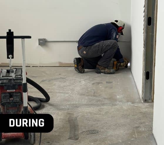 MACH ONE® employee installing new flooring for Soggy Doggie Resort