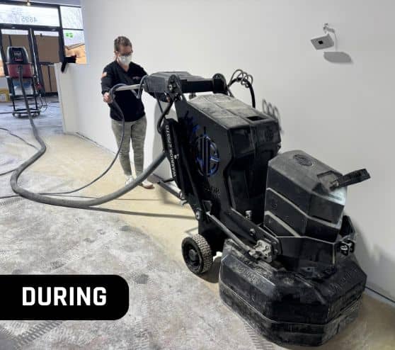 MACH ONE® employee using machine on Soggy Doggie Resort flooring