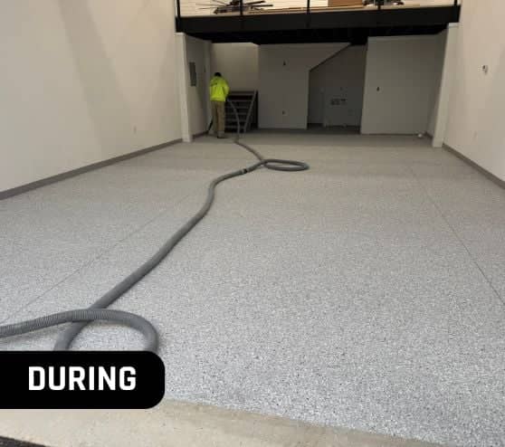 during portrait of MACH ONE® employee installing Feathered Gray Epoxy Flake Flooring