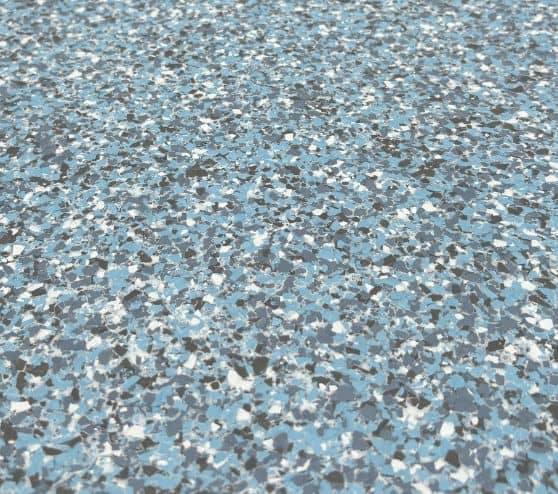 close-up of blue epoxy flake flooring