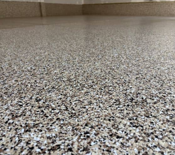 close-up of Cappuccino epoxy flake flooring