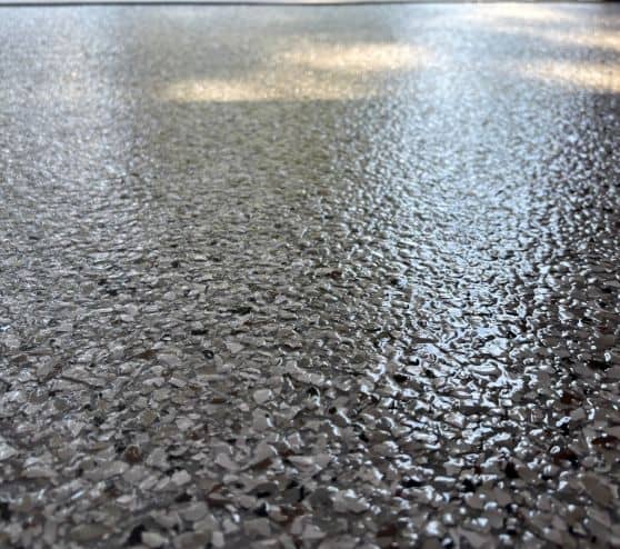 close-up of dakota grey epoxy flake flooring