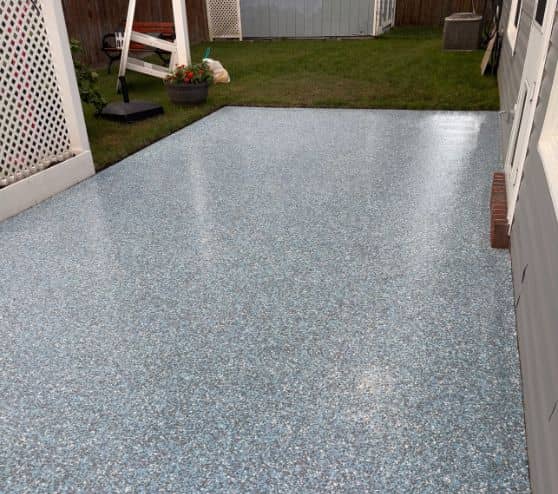 homeowner back patio with new epoxy flake flooring