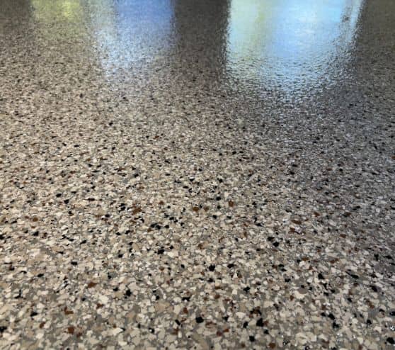 close-up of dakota grey epoxy flake flooring