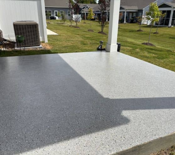 homeowner patio with new epoxy flake flooring installed side view