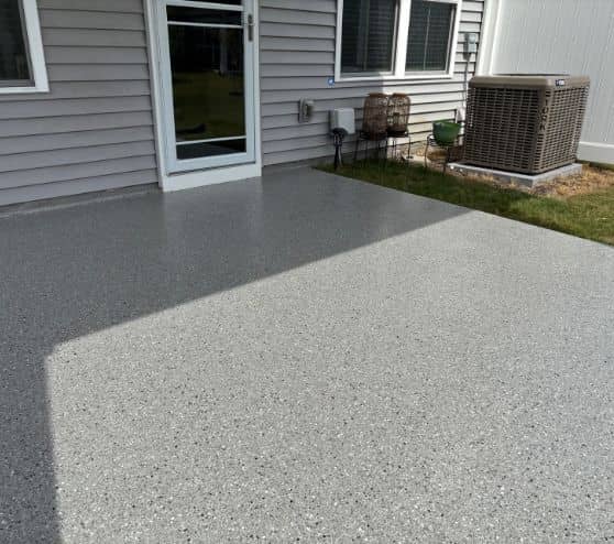 homeowner patio with new epoxy flake flooring installed
