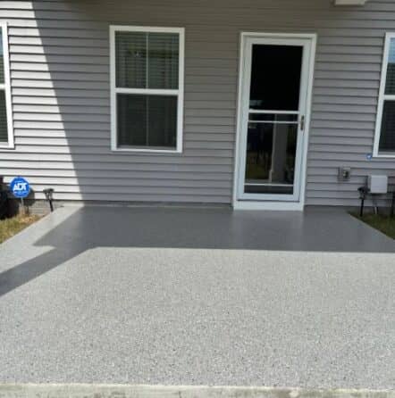front view of exterior patio with new epoxy flake flooring