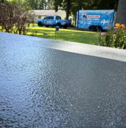 close-up of homeowner carport with new epoxy flake flooring
