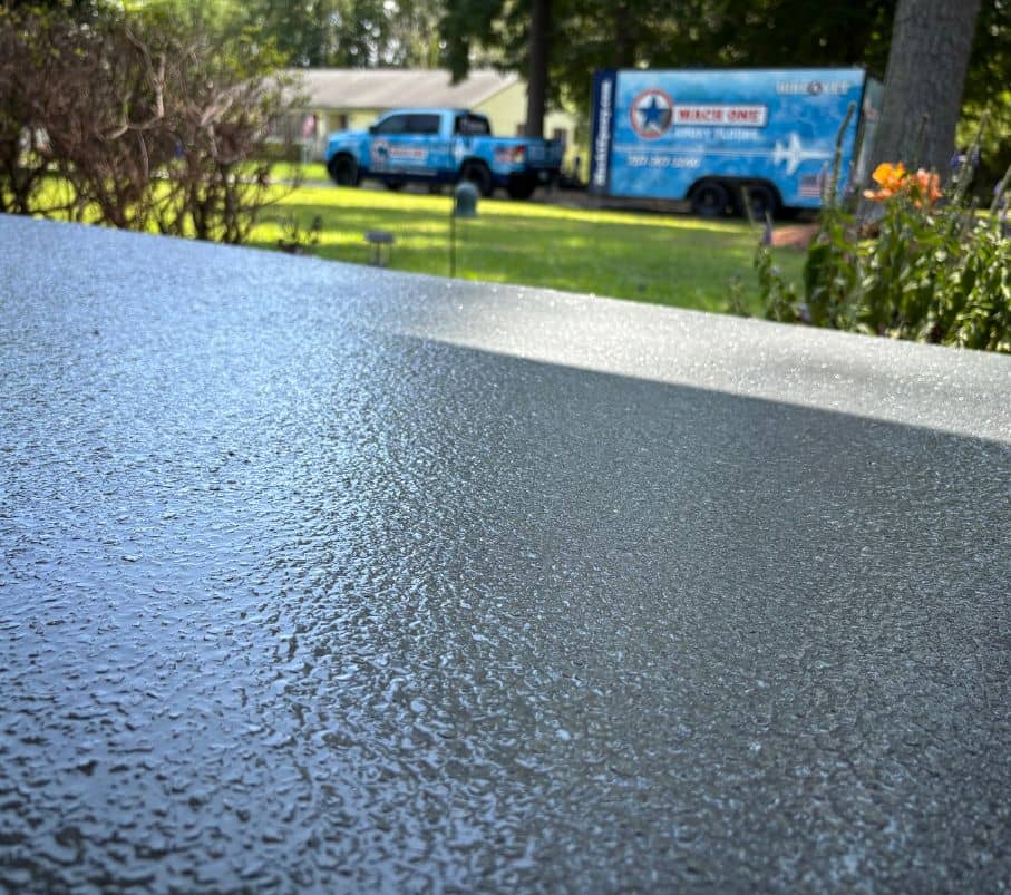 close-up of homeowner carport with new epoxy flake flooring