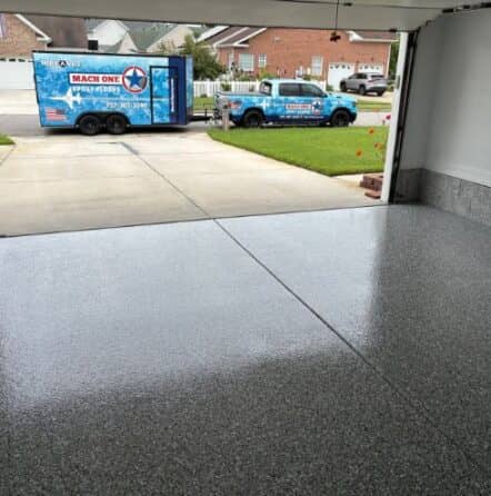 homeowner garage with new grey epoxy flake flooring installed