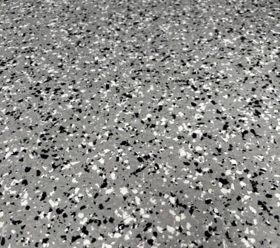 close-up of grey epoxy flake flooring for homeowner garage