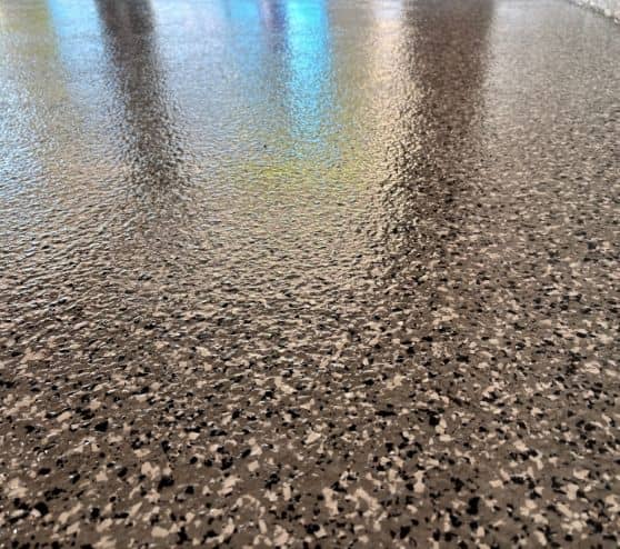 close-up of grey epoxy flake flooring for homeowner garage