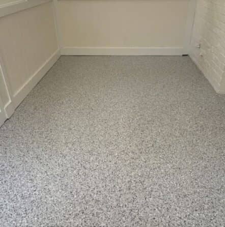 front view close-up of new epoxy flake flooring installed for patio