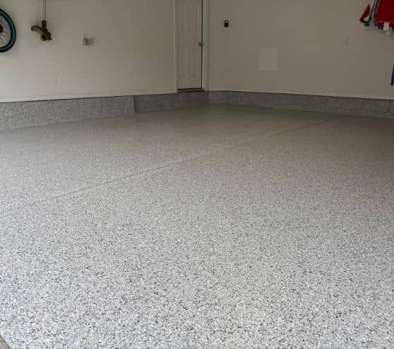 homeowner garage with new epoxy flake flooring