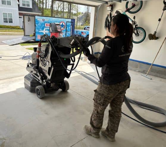 MACH ONE® employee using machine on garage floor