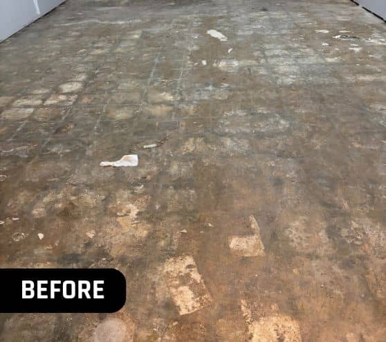 close-up of old stained concrete flooring inside of mathews museum