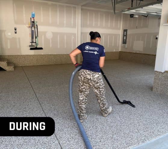 MACH ONE® employee installing new flooring for homeowner garage