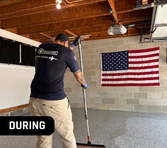 MACH ONE® employee installing new flooring for homeowner garage