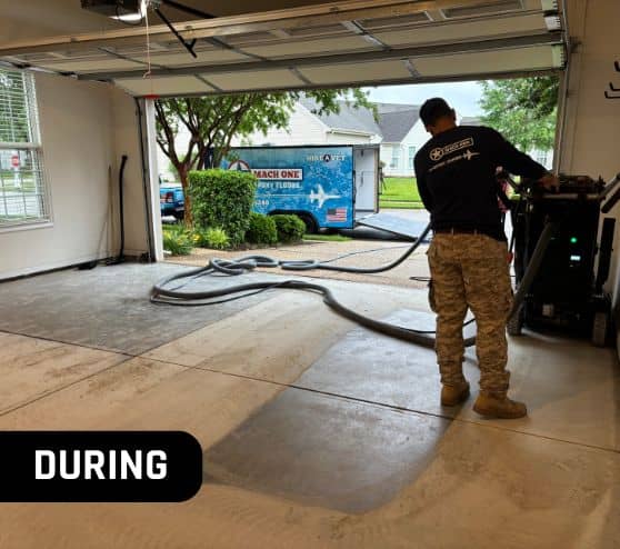 MACH ONE® employee installing new flooring for homeowner garage