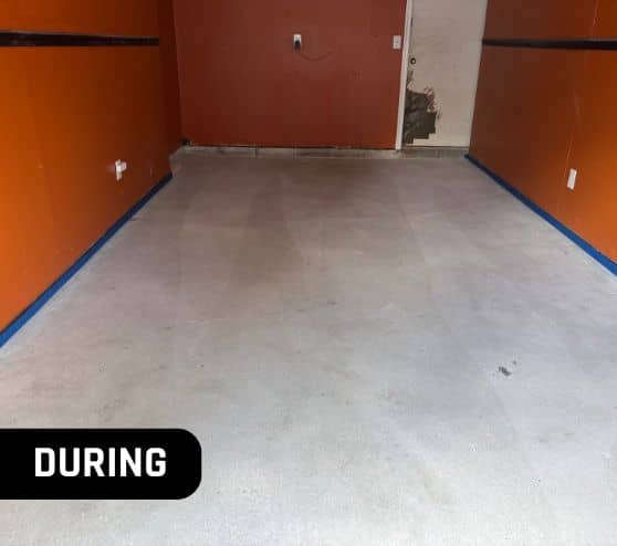 during portrait of homeowner garage with new flooring getting installed
