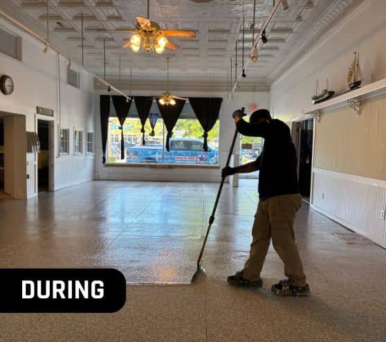 employee installing new flooring for mathews museum during portrait