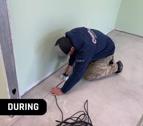 during portrait of mach one® employee installing new flooring