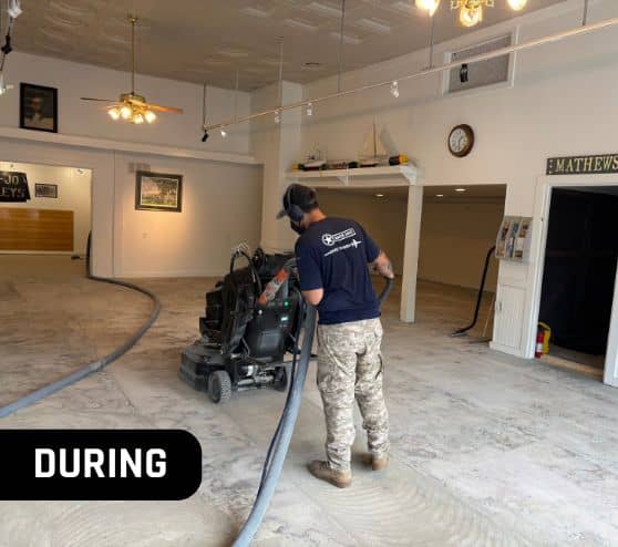 mach one® employee using machine on old flooring for mathews museum