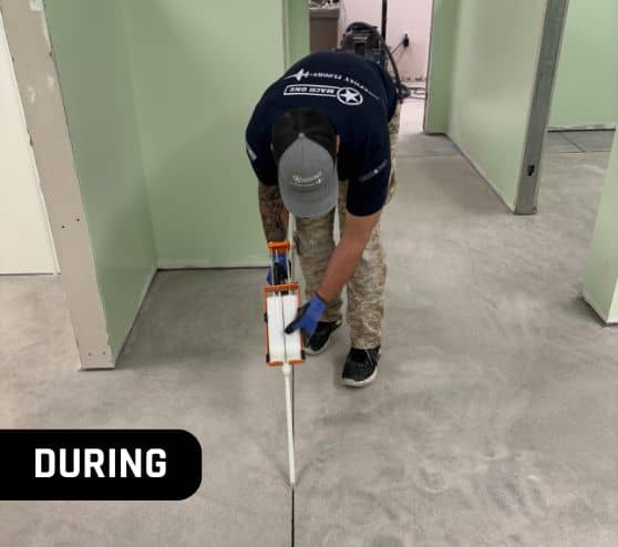 MACH ONE® employee installing new flooring