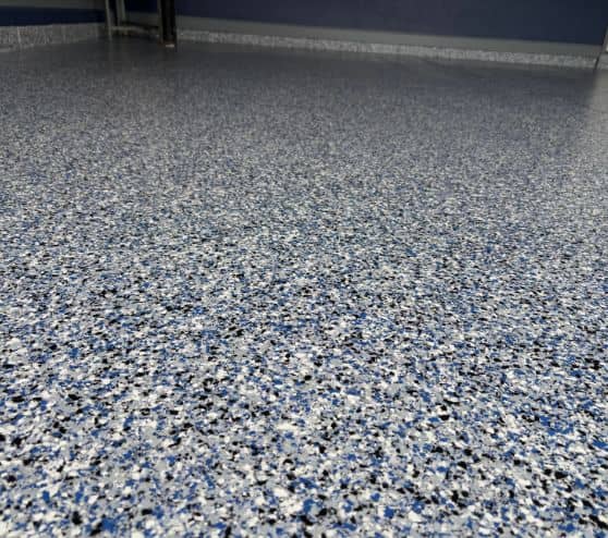 close-up of Orbit Epoxy Flake Flooring for homeowner garage