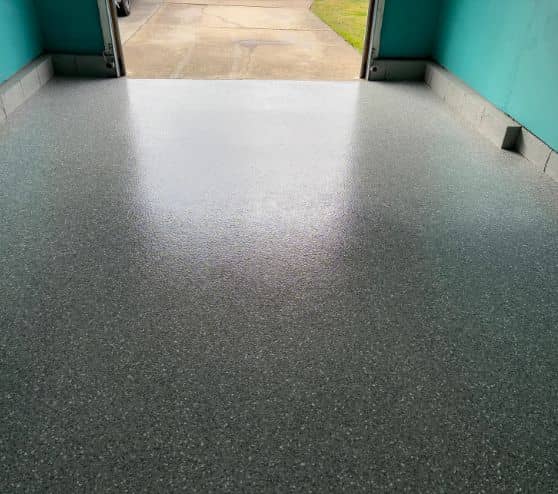 close-up of homeowner garage with new Smoke Epoxy Flake Flooring installed